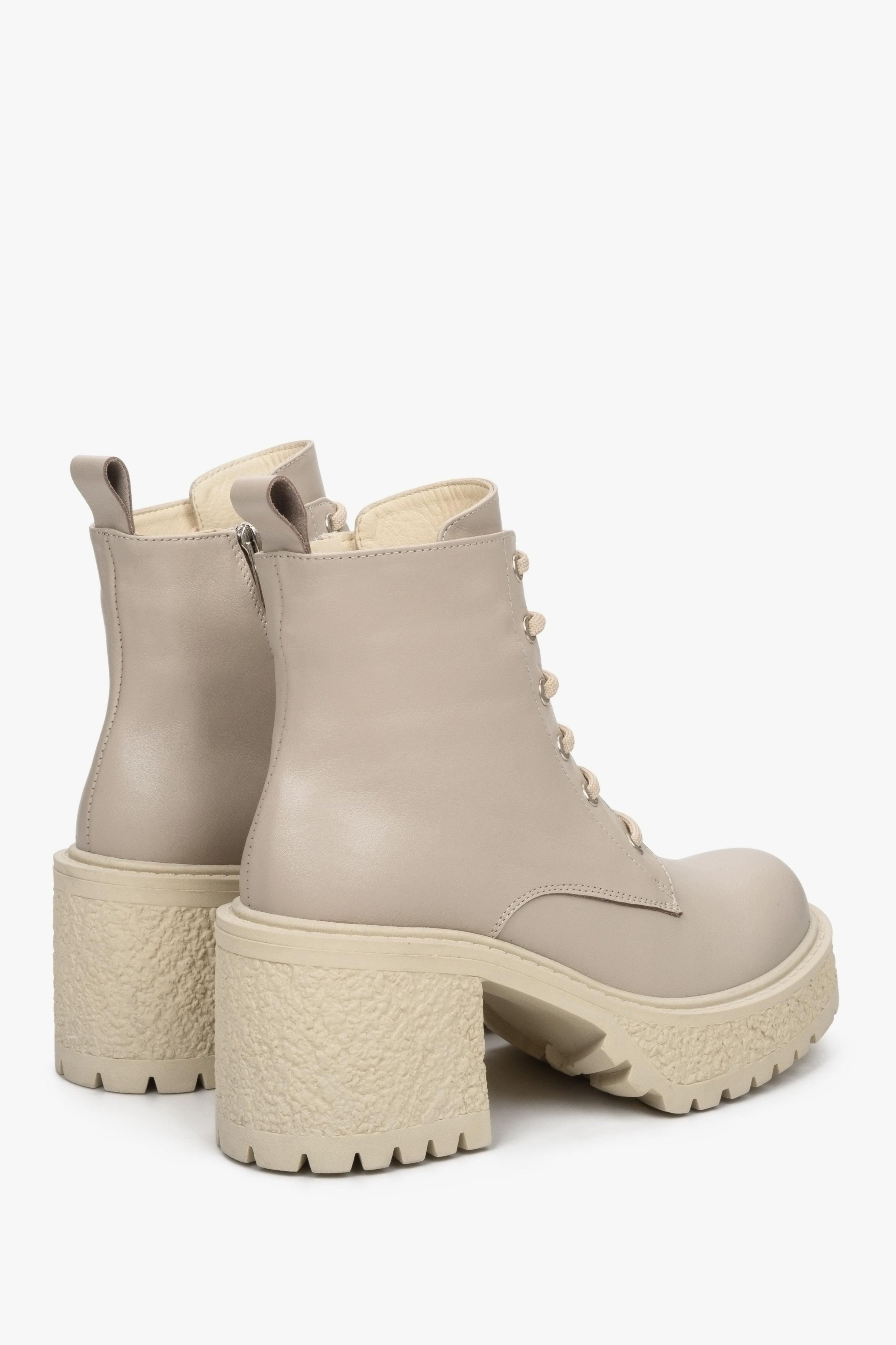 Beige women's leather ankle boots with a heel - close-up of the lateral sidewall and back of the shoe.