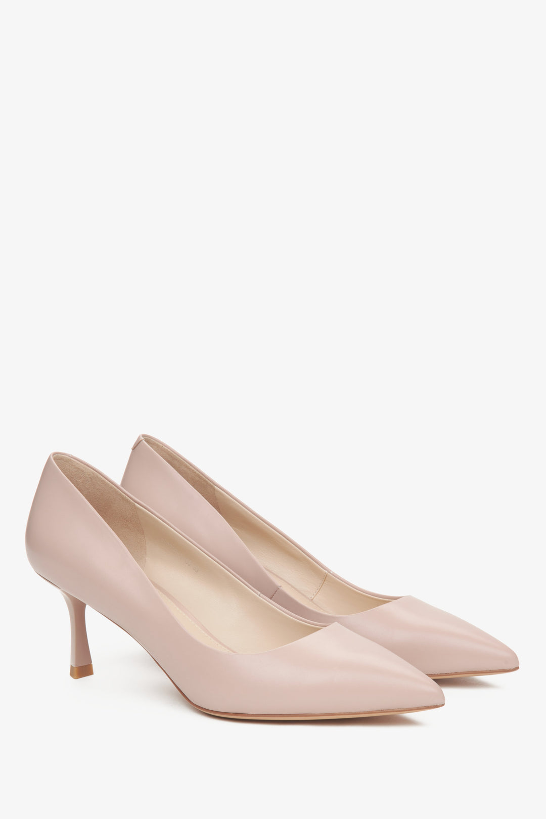 Women's beige pumps with pointed toe on a stable heel.