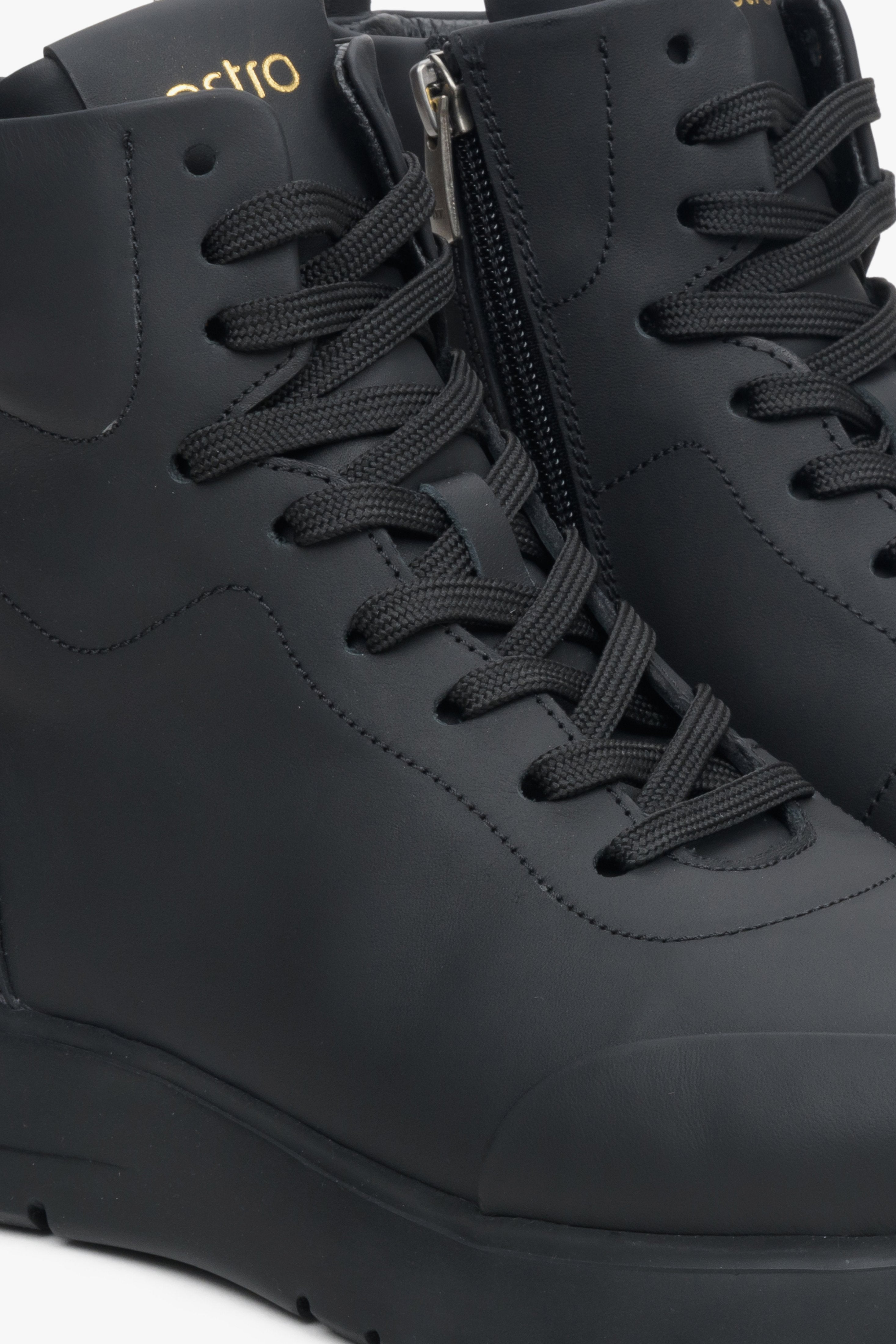 Womens black high-top sneakers by Estro - close-up on the lacing system.