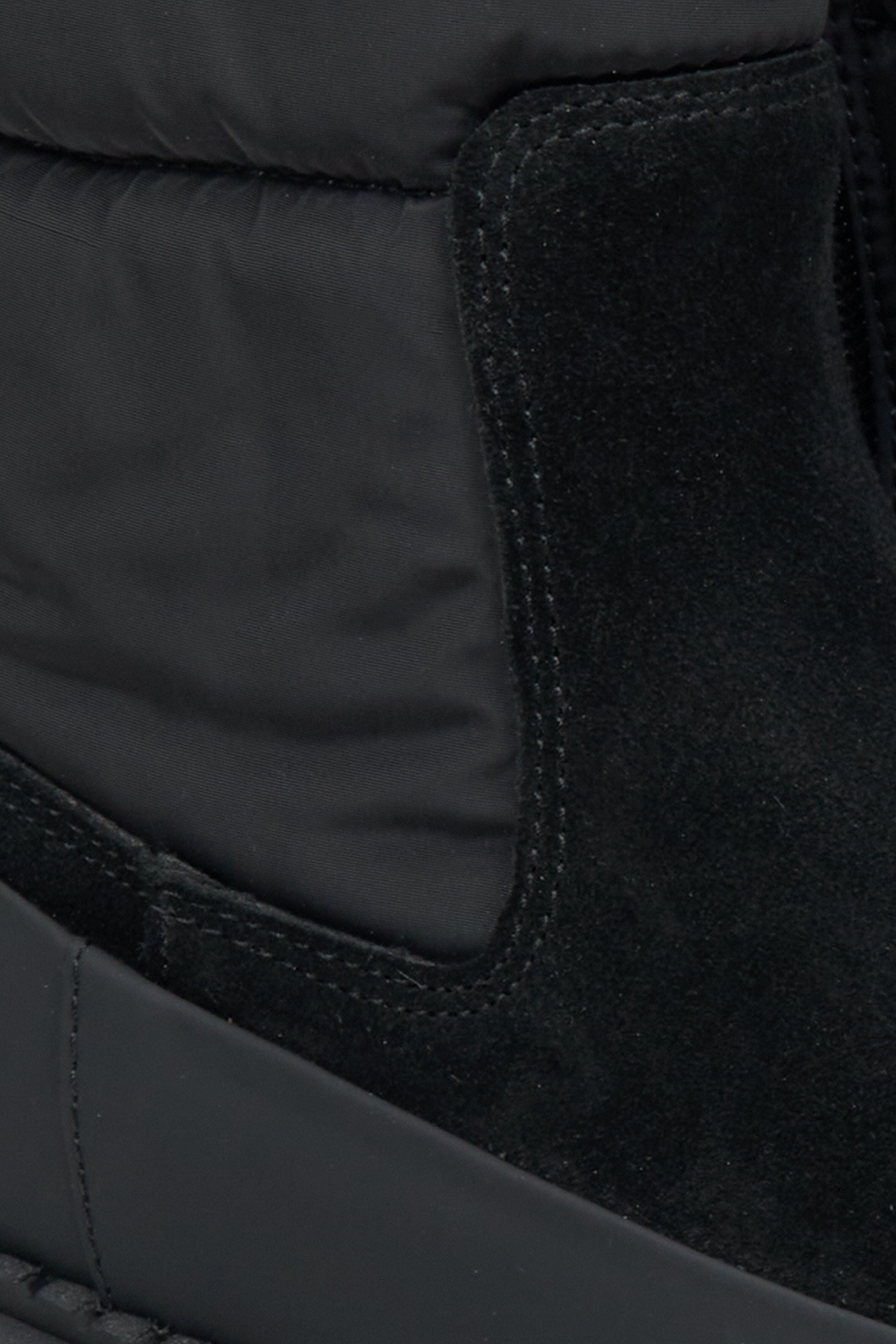 Women's black ankle boots - a close-up on details.