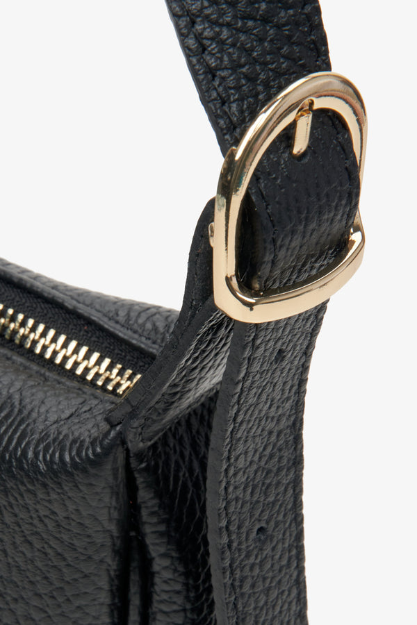 Women's black small leather  shoulder bag with gold accents by Estro - close-up of the details.