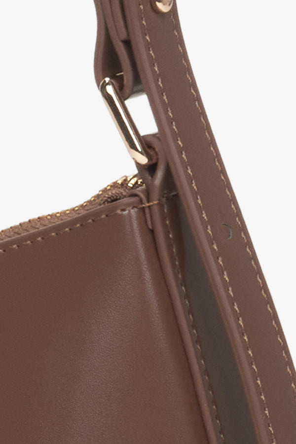 Women's saddle brown baguette bag -  a close-up on details.