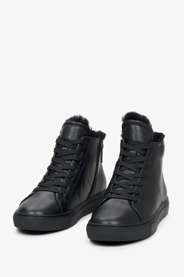 High-top women's black sneakers made of genuine leather by Estro - close-up on the front part of the shoe.