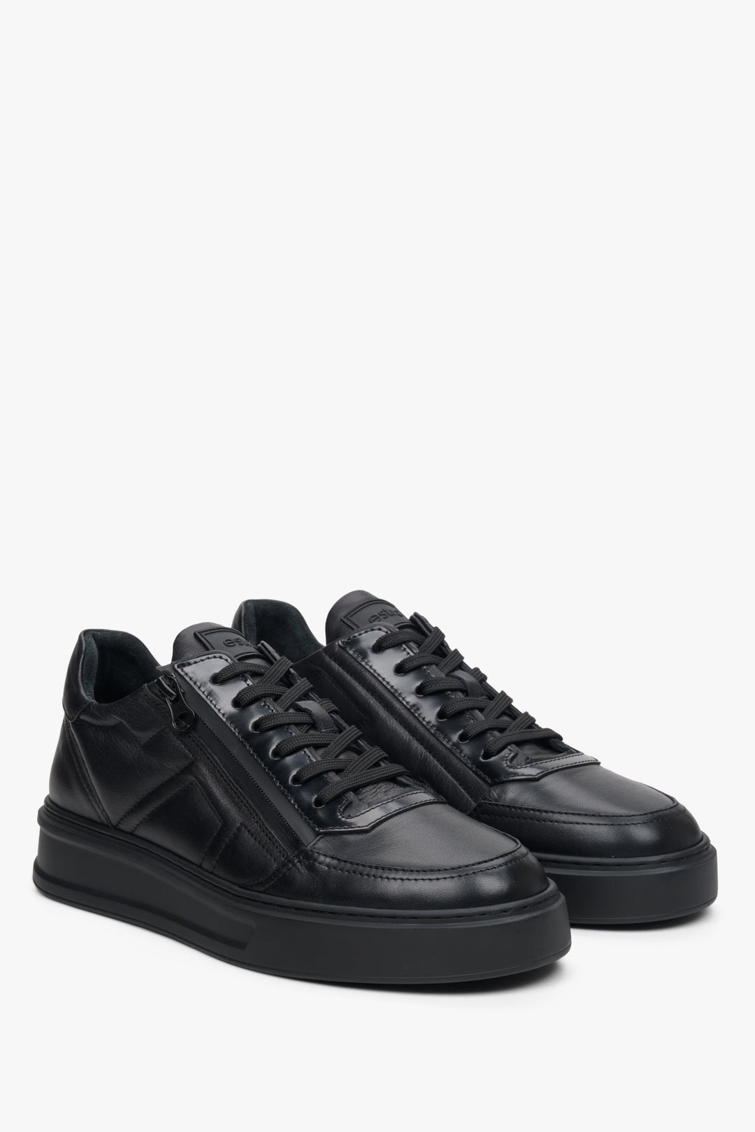 Men's black leather sneakers with decorative zipper by Estro - close-up on the toe cap.