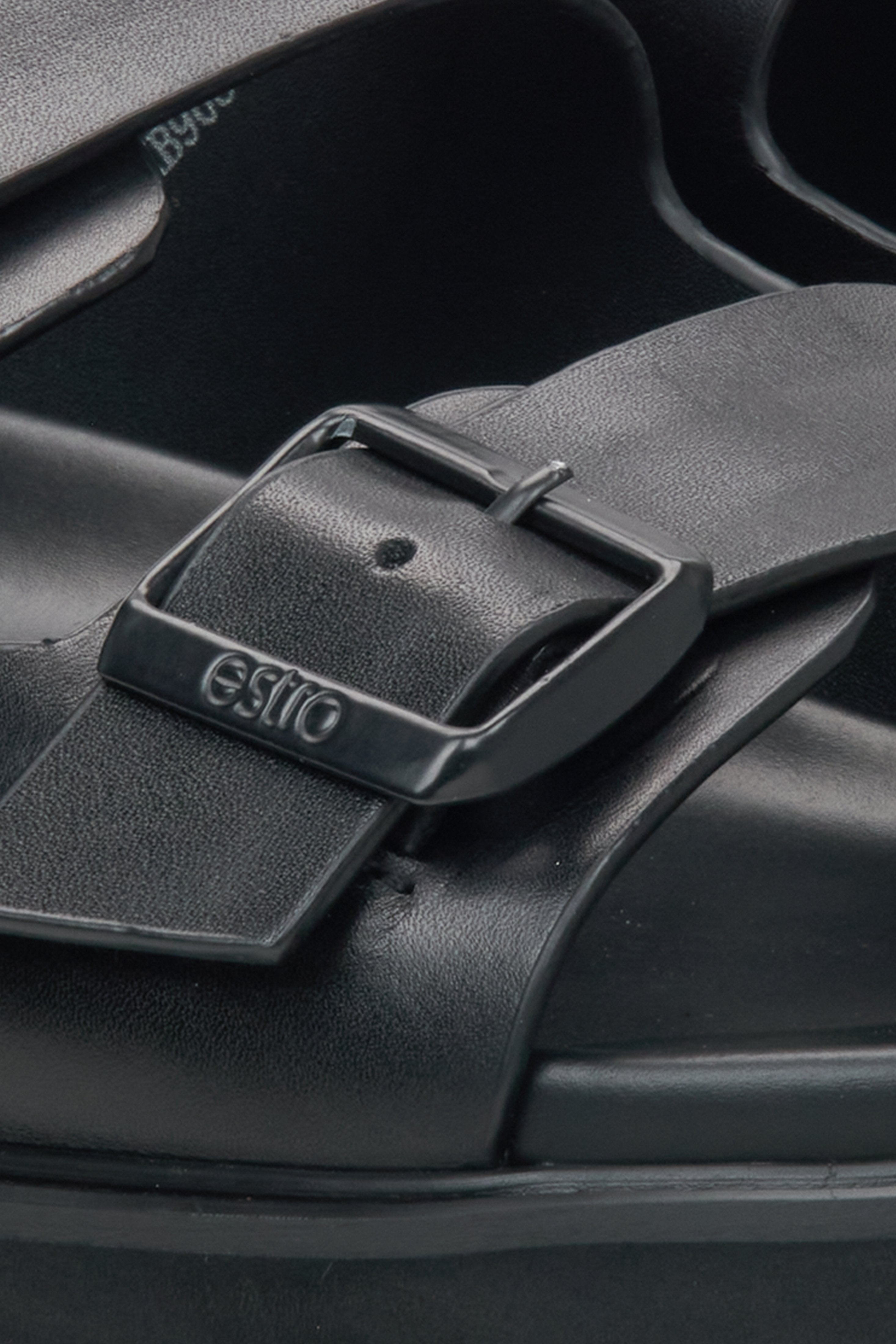 Estro men's black slides - close-up on detail.