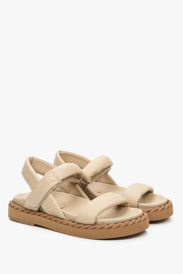 Women's sandals for summer in beige colour made of natural leather on a comfortable sole.