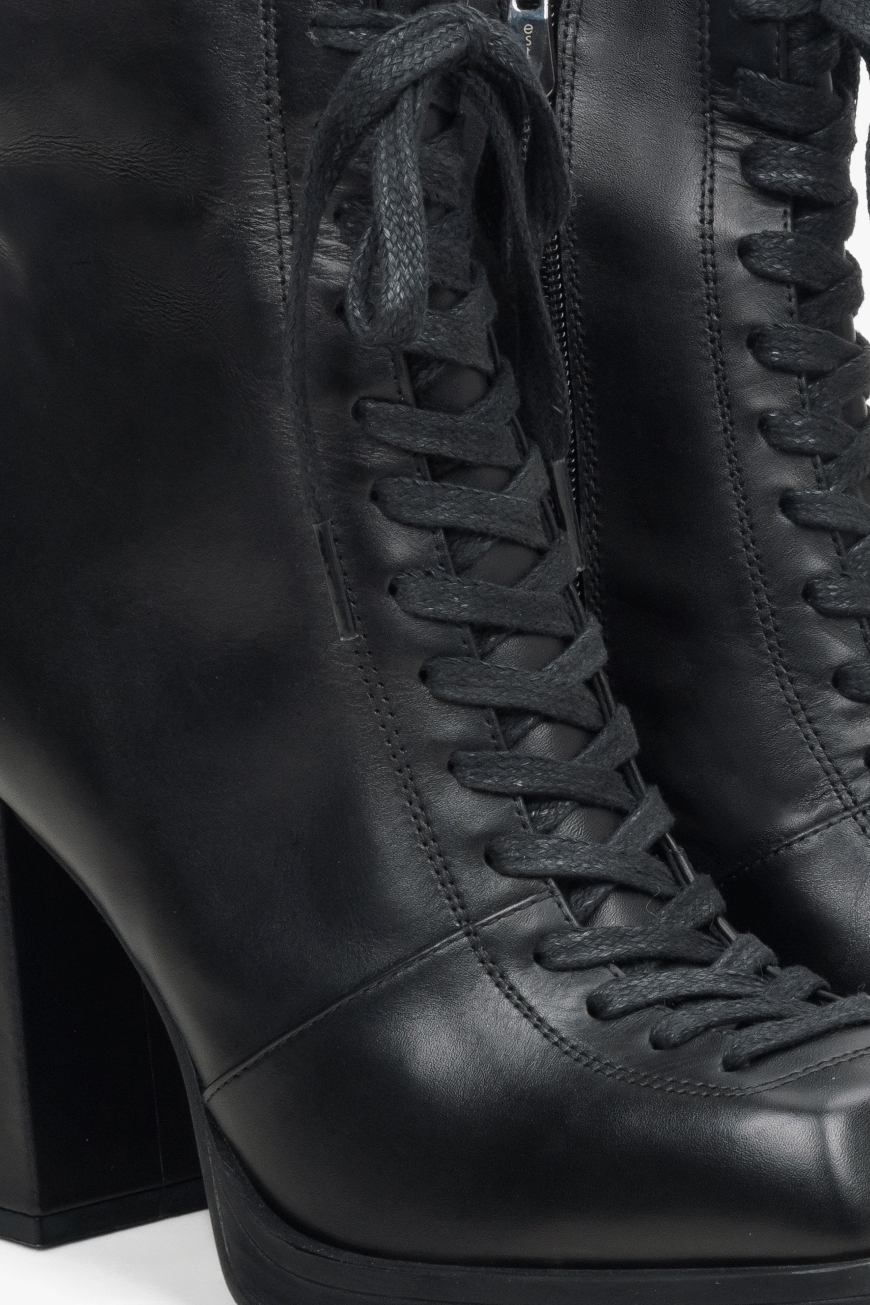 Women's black leather ankle boots with a block heel - shoe details.