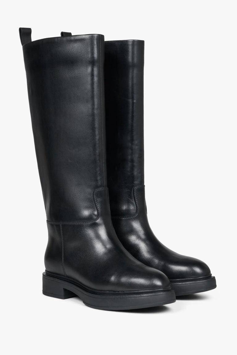 Elevated, black Estro women's leather boots with natural fur for winter.