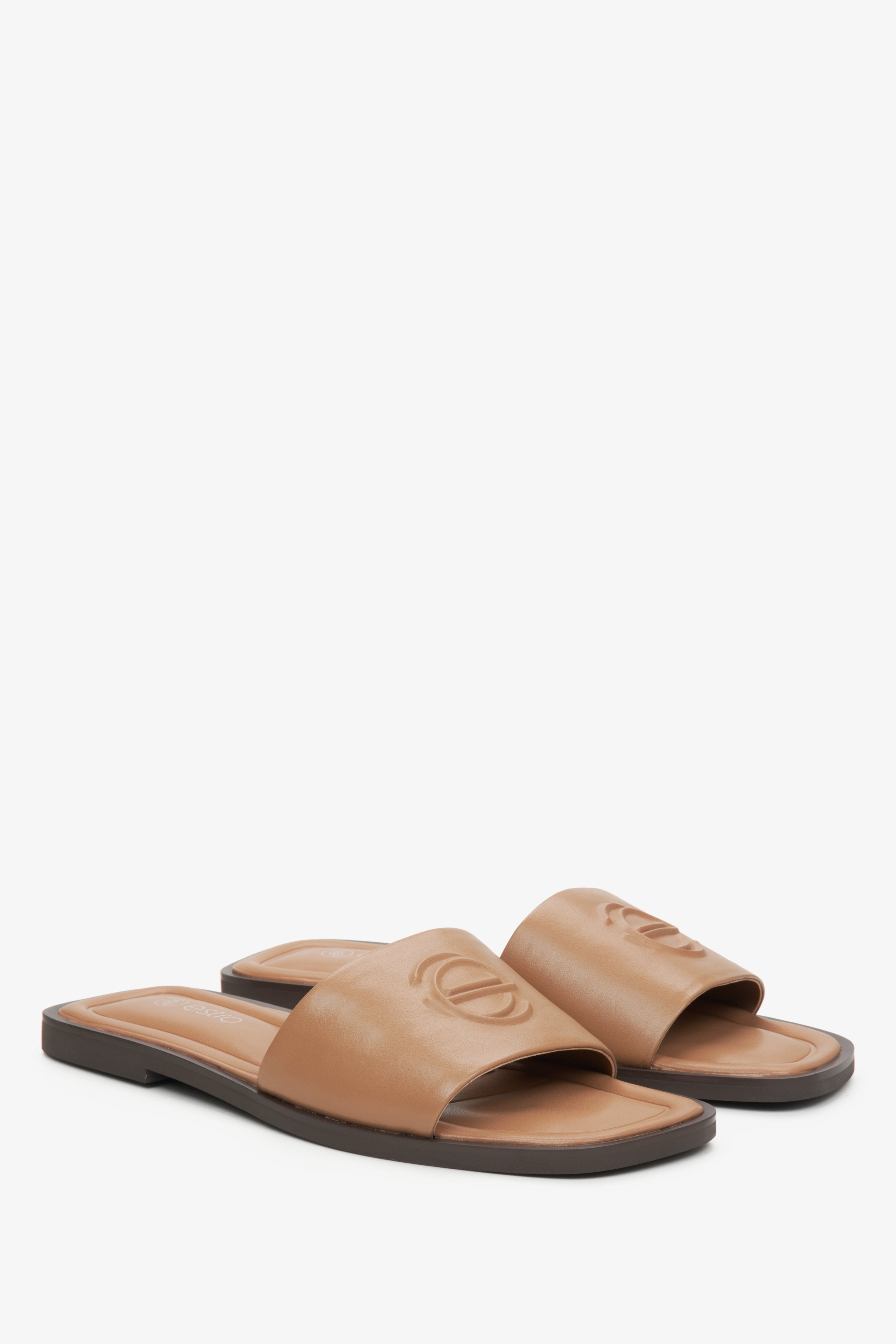 Estro women's brown leather slides.