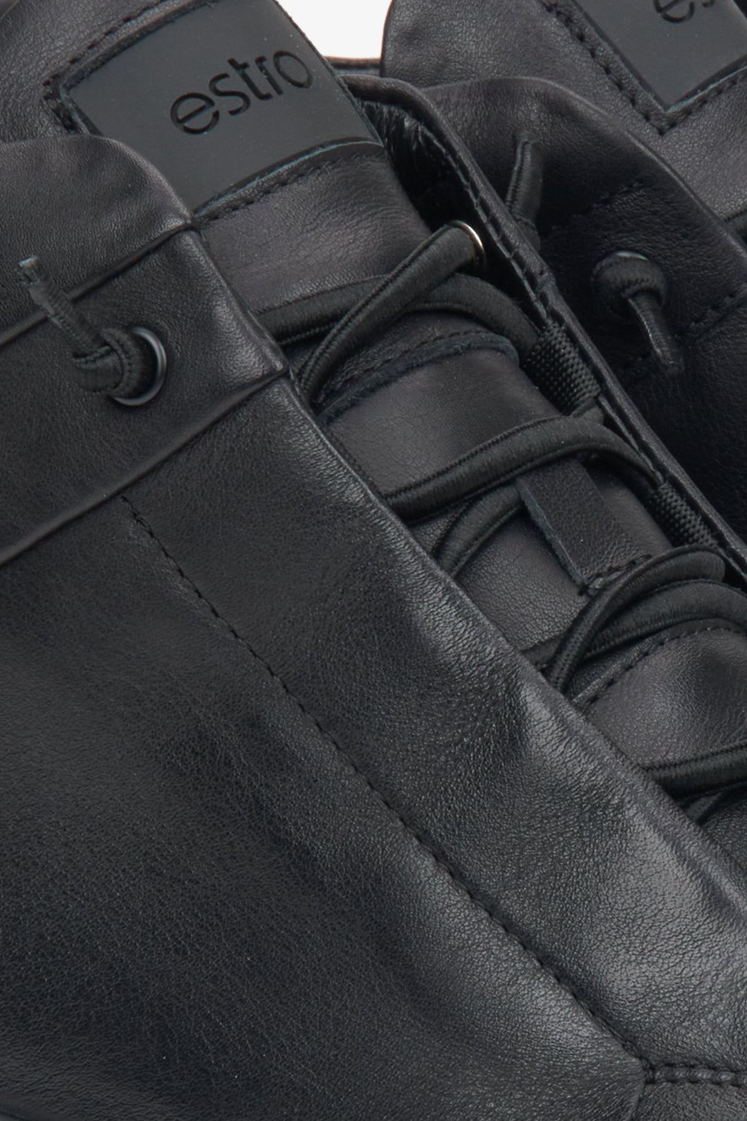 Black high-top men's sneakers made of genuine leather by Estro - close-up of details.