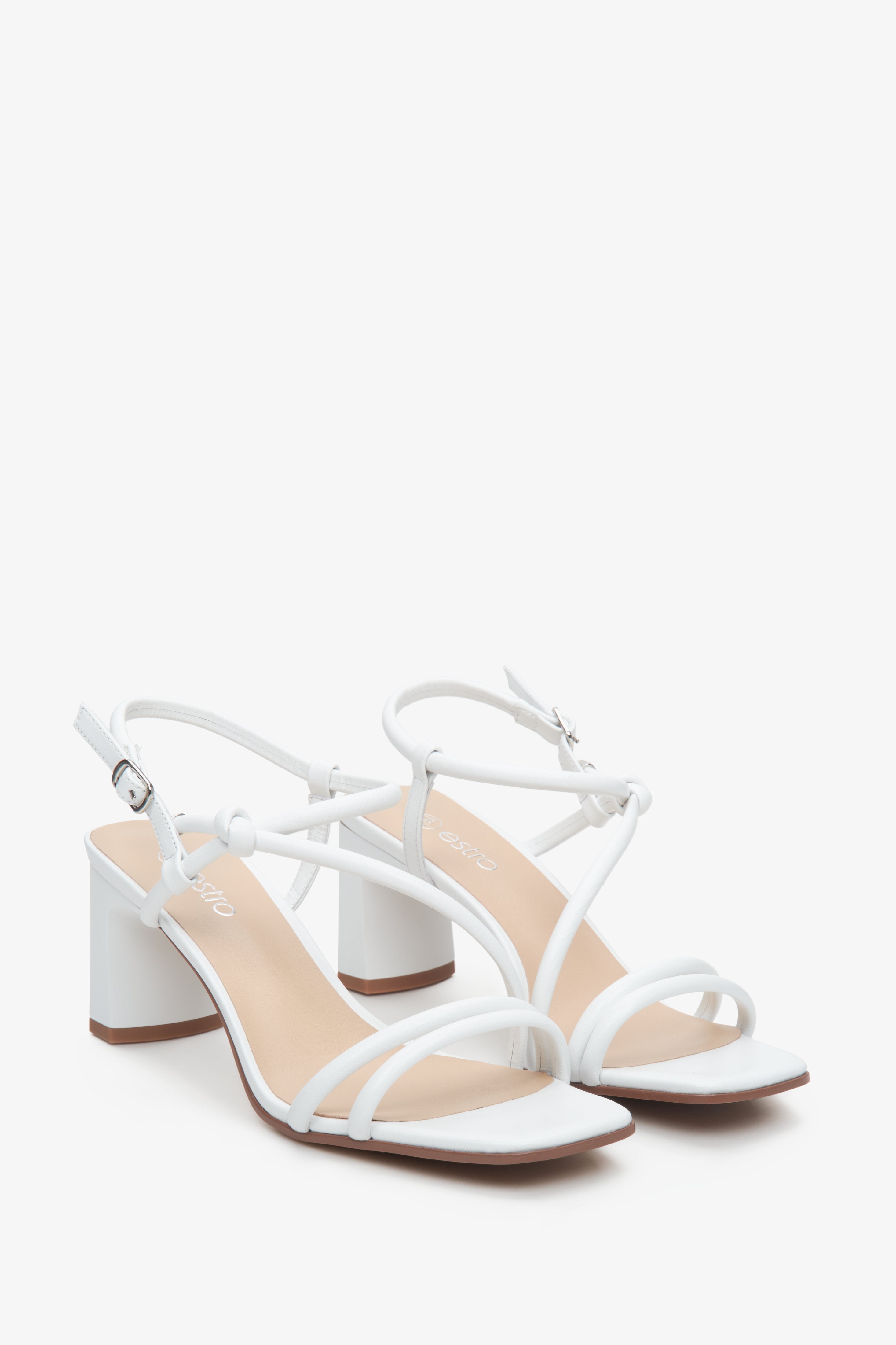 Perfect women's sandals, adorned in white leather and equipped with a sturdy heel.