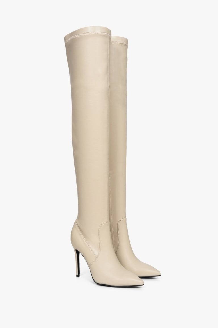 High women's boots by Estro with elastic upper in beige color - footwear presentation from the front and side.