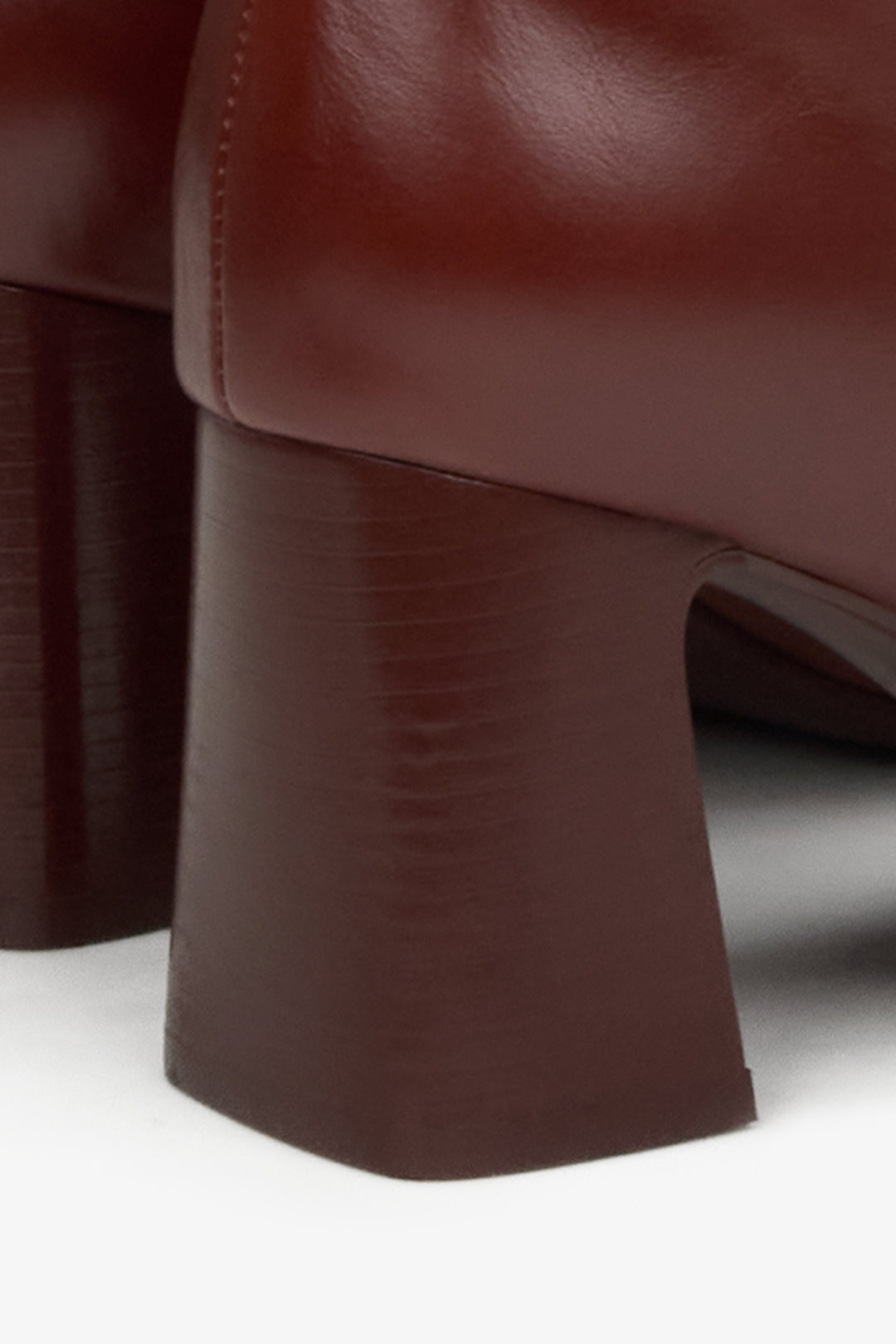 Genuine leather burgundy high boots - a close-up on details.
