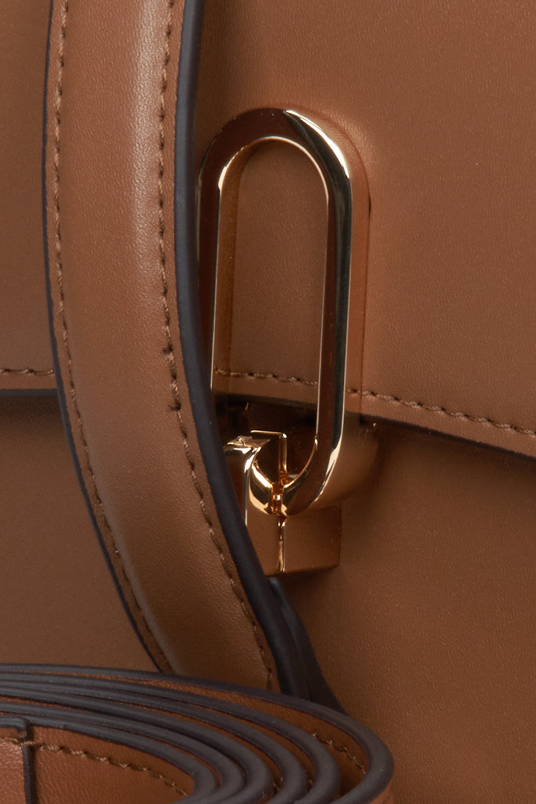 Stylish, brown women's handbag Estro made of genuine leather - close-up on details.