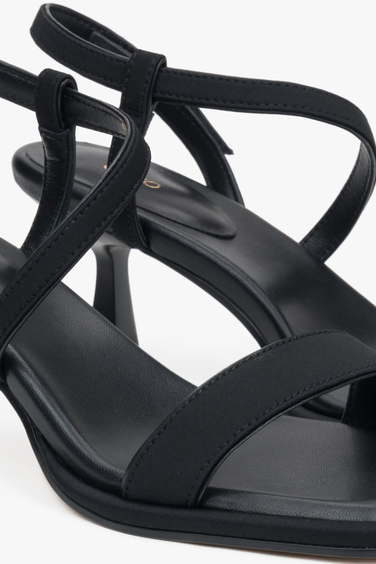 Black heeled women's sandals by Estro, combining genuine leather and textiles.