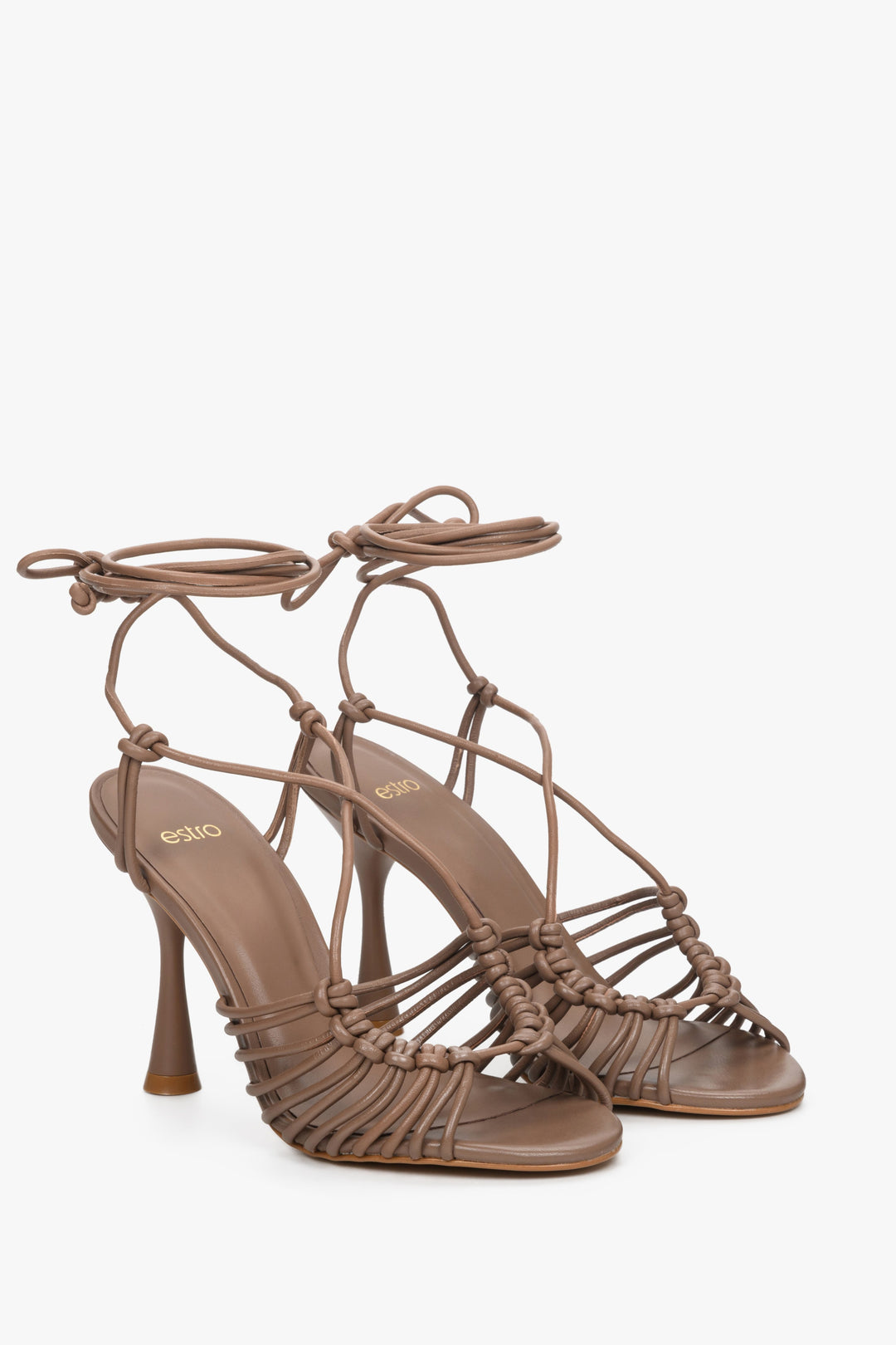 Women's brown cupped heel sandals made from genuine leather - model presentation.