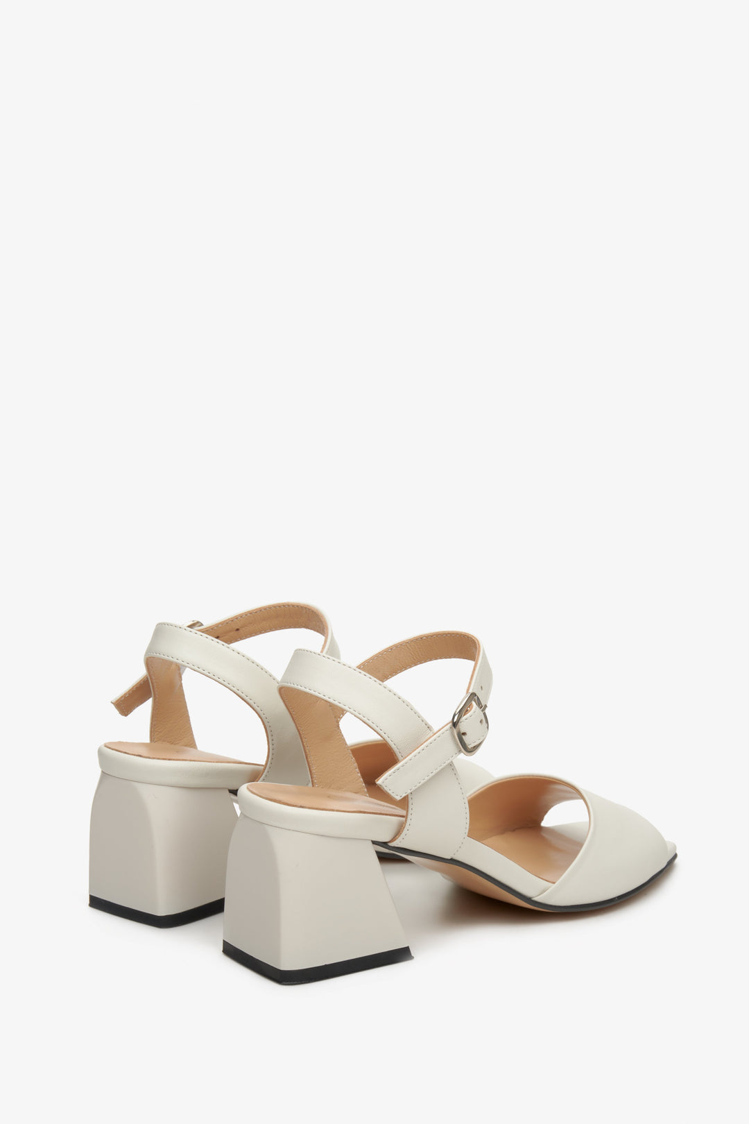 Women's beige leather  sandals by Estro - close-up on the block heel and side profile of the shoes.