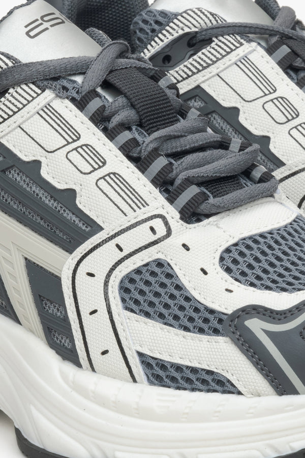 Close-up on details of women's grey sneakers ES8 in mixed materials.