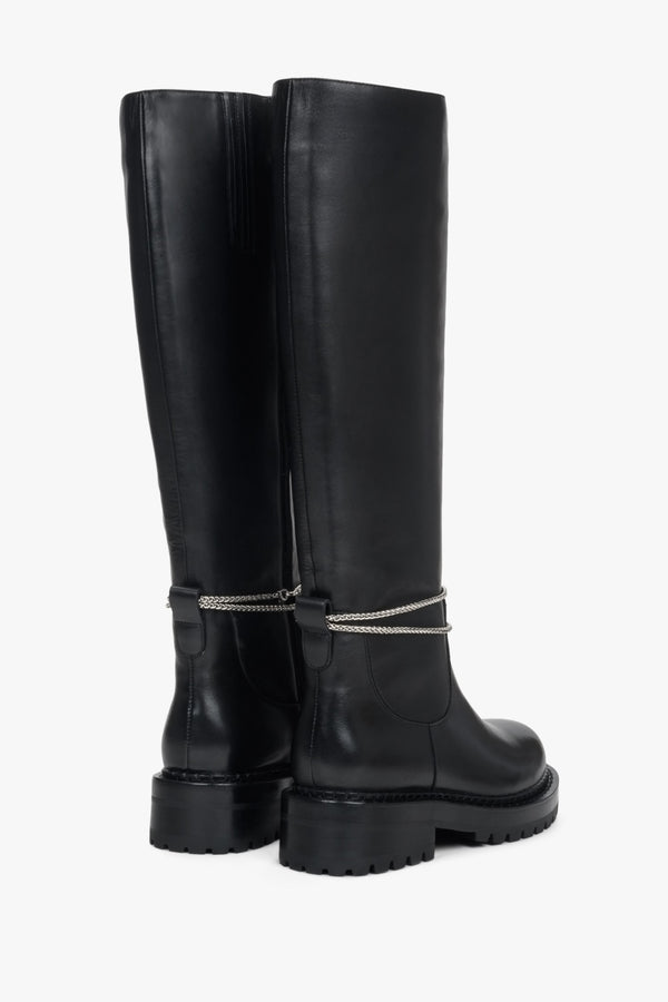 Women's black leather winter boots - close-up on the back of the model.