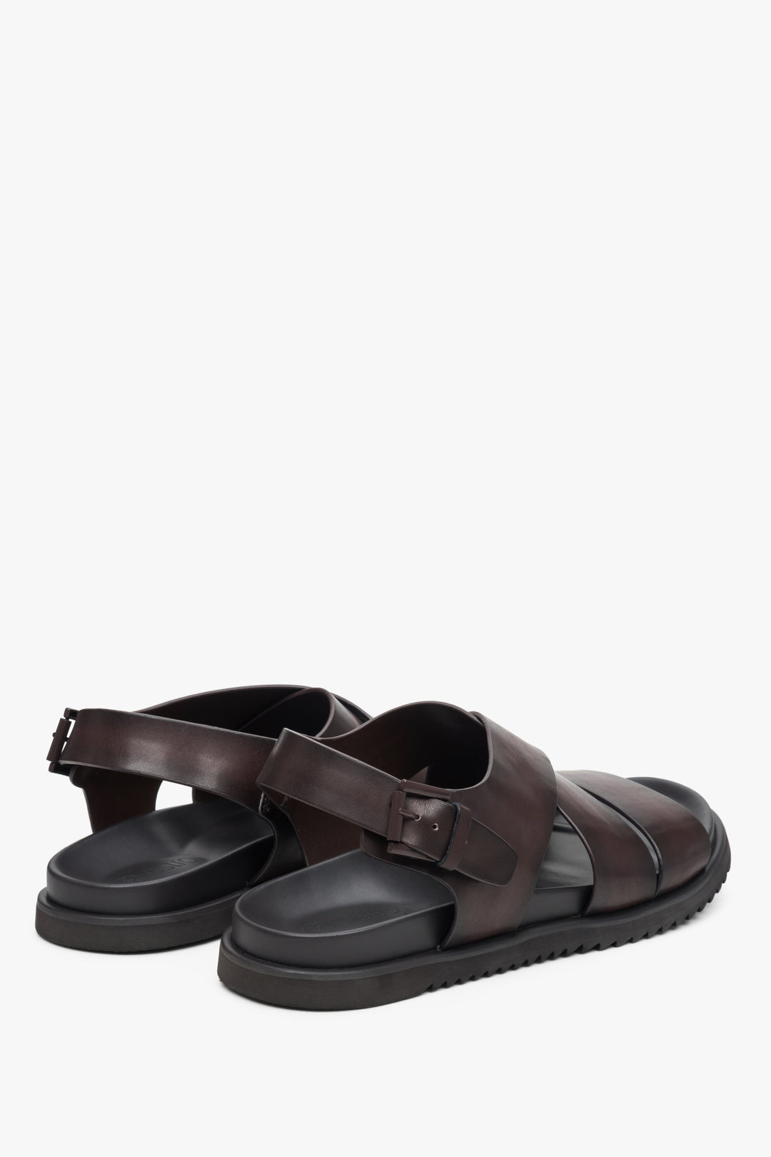 Men's brown  leather sandals by Estro with thick, crossed straps - close-up of the side seam and heel.