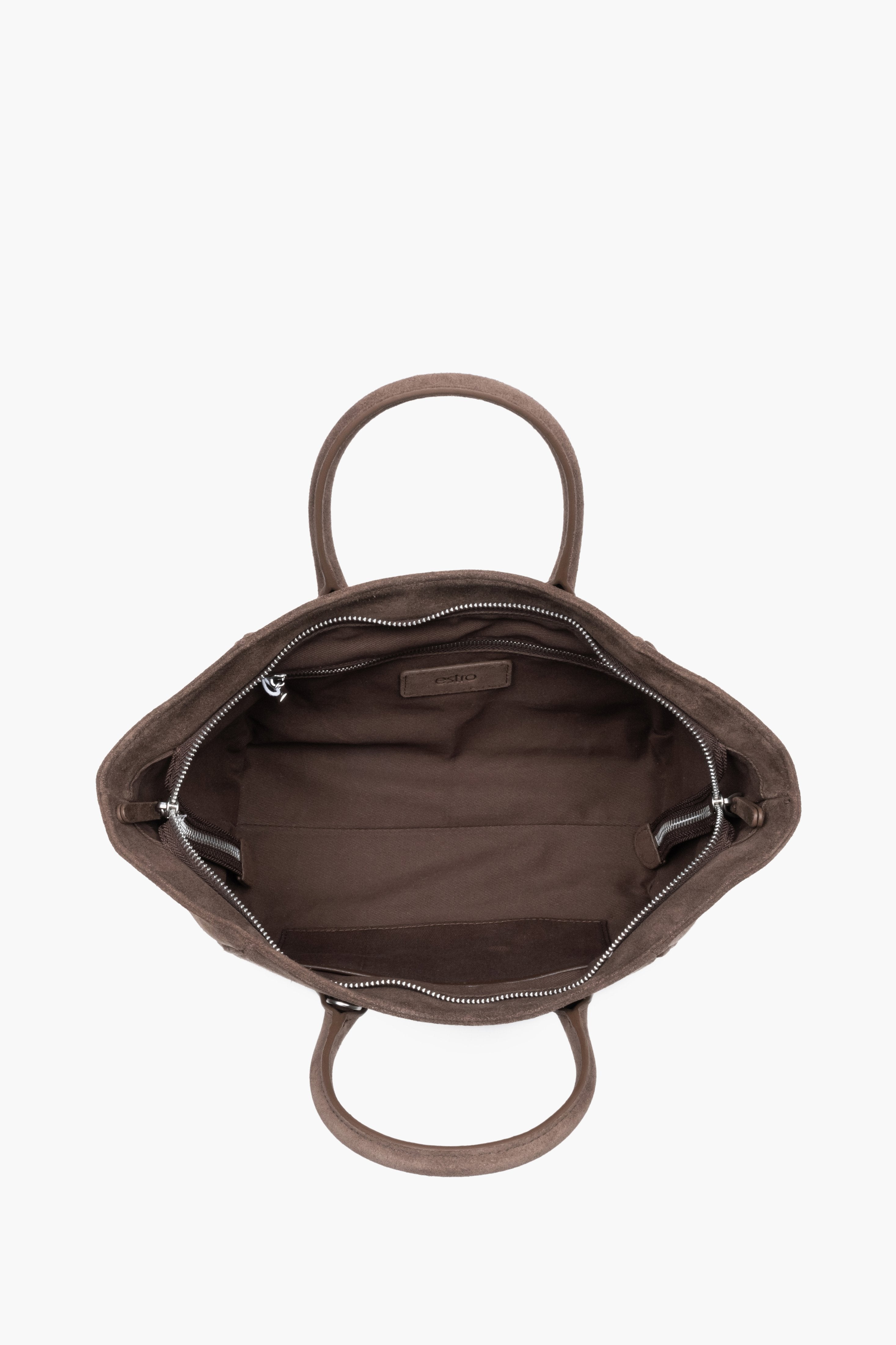 Top view of the open zippered main compartment, showing wide access to the lining and functional internal pockets.