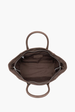 Top view of the open zippered main compartment, showing wide access to the lining and functional internal pockets.