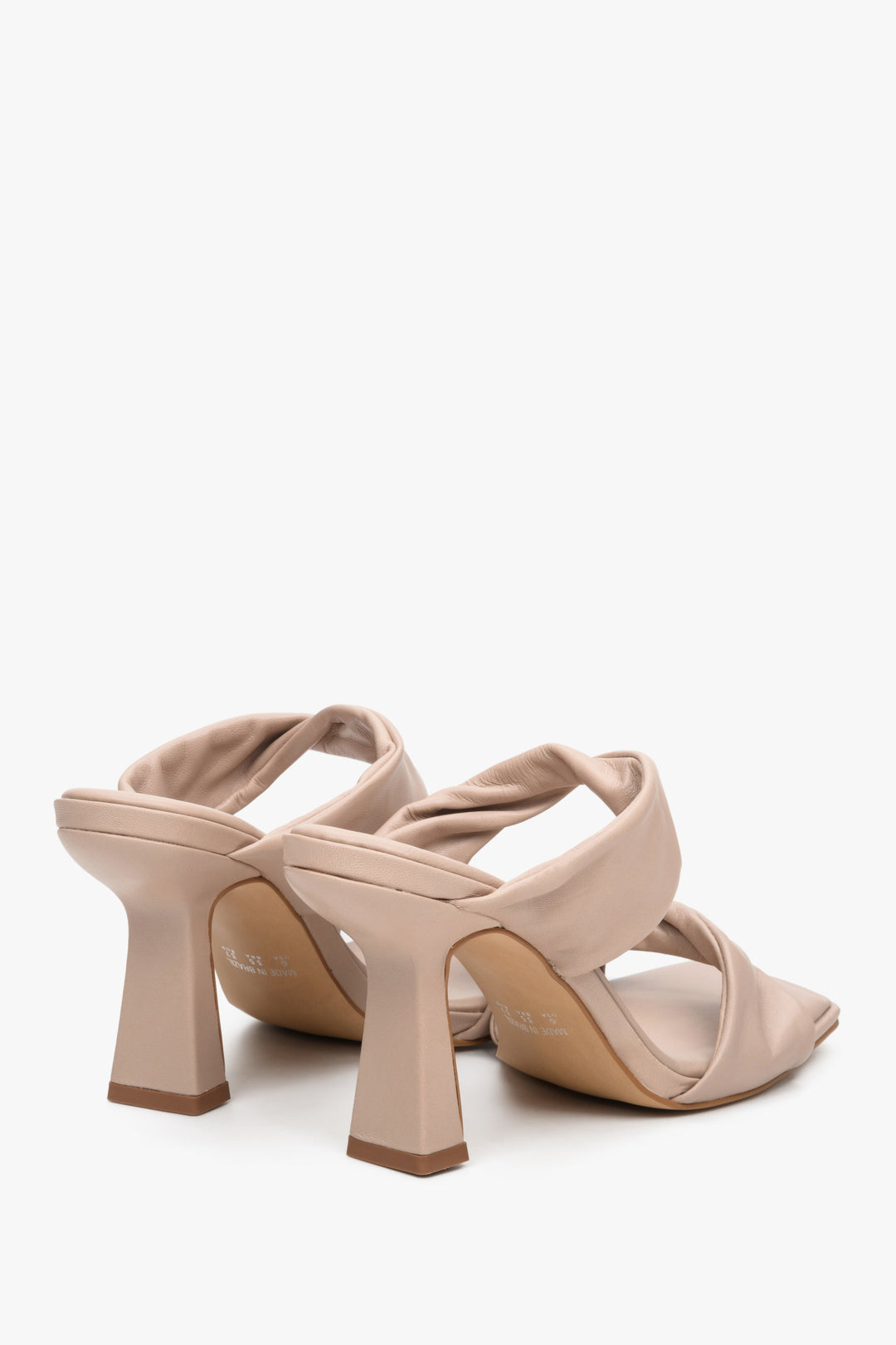 Women's beige leather heeled sandals - close-up on the heel.