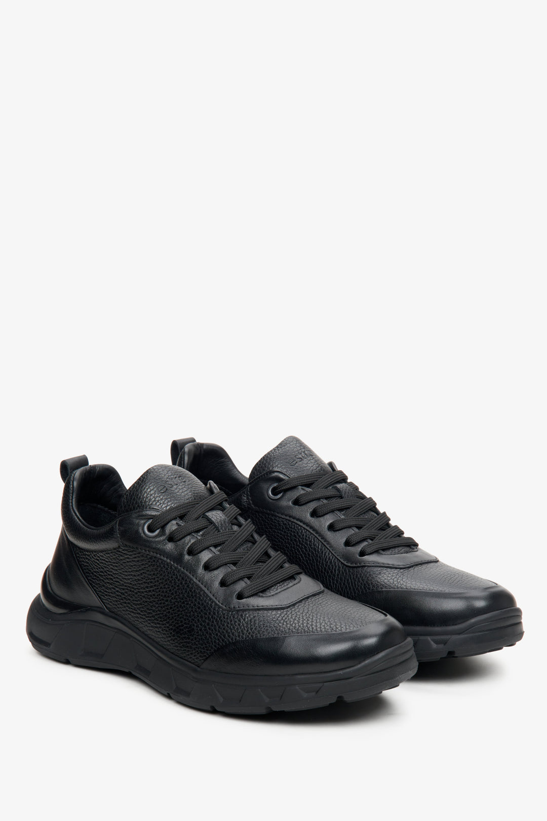 Men's black sneakers made of textured genuine leather by Estro.