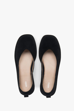 Soft women's ballet flats made of perforated genuine velour in a black shade by Estro – top view presentation.