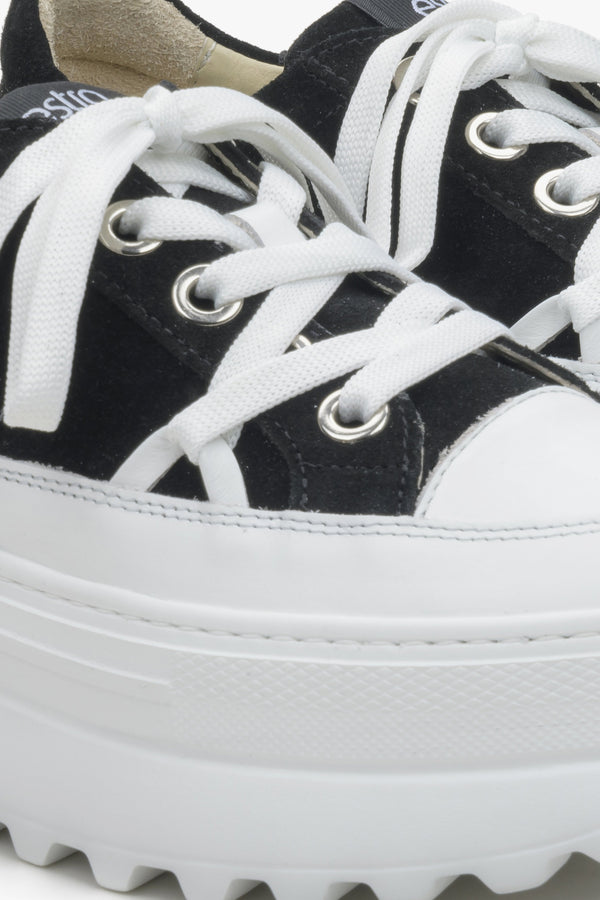 Women's Estro white and black sneakers - close-up on details.