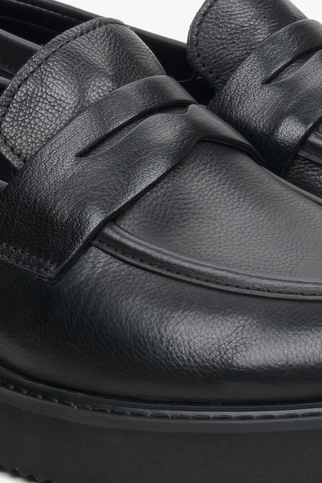 Men's black leather Estro loafers - close-up on the stitching pattern.