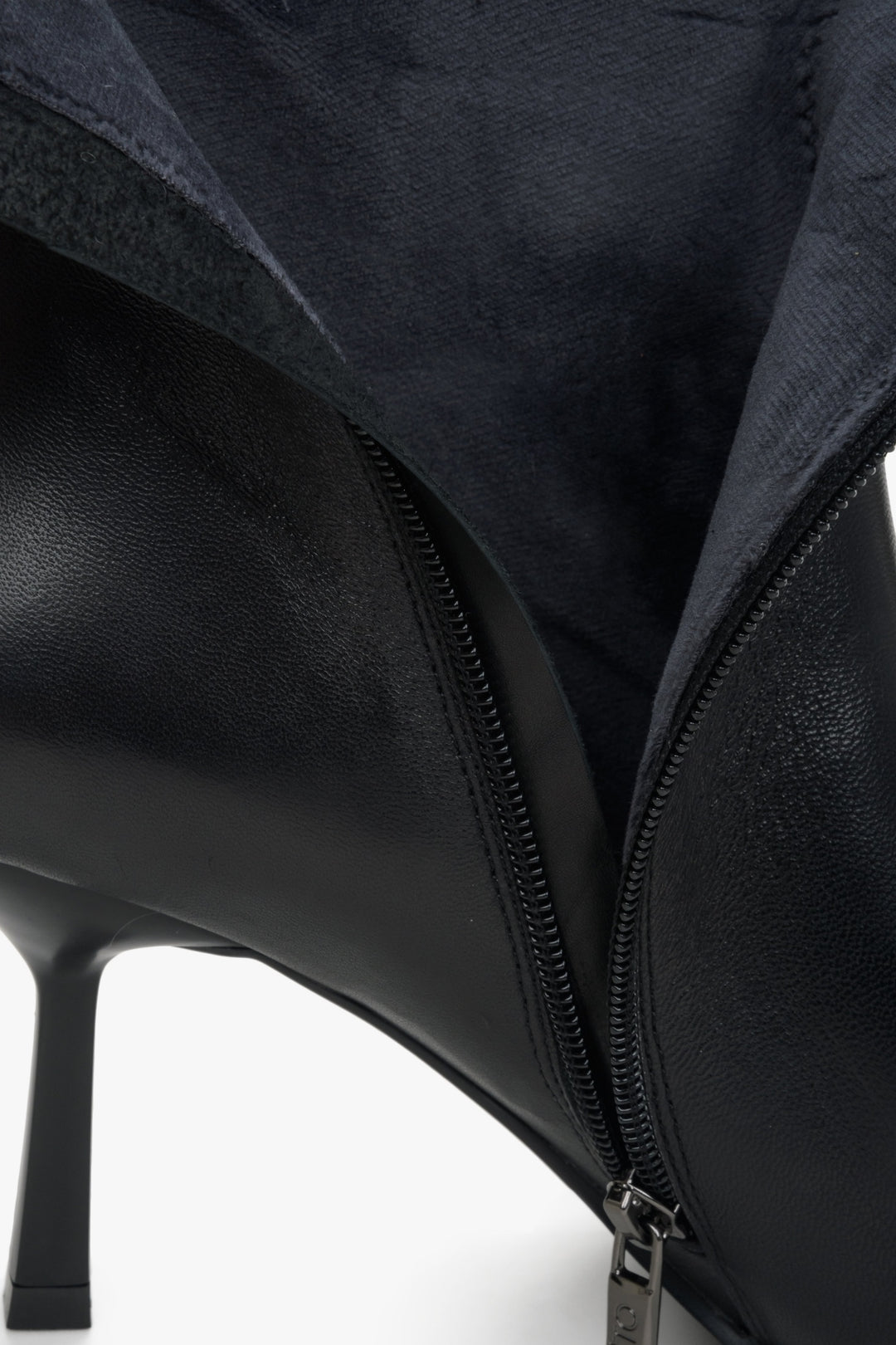 Women's black leather boots with a heel made of genuine leather by Estro - close-up on the inside of the shoe.