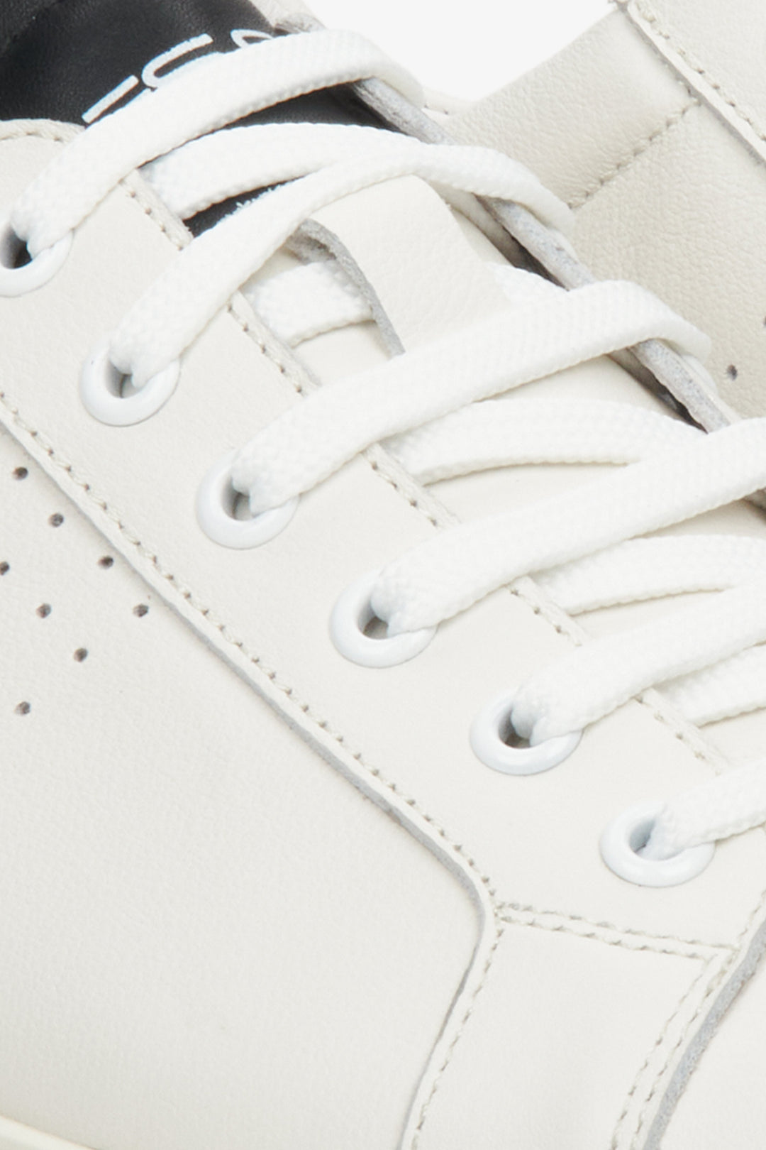 Men's black and white sneakers for spring and autumn - close-up on the details.