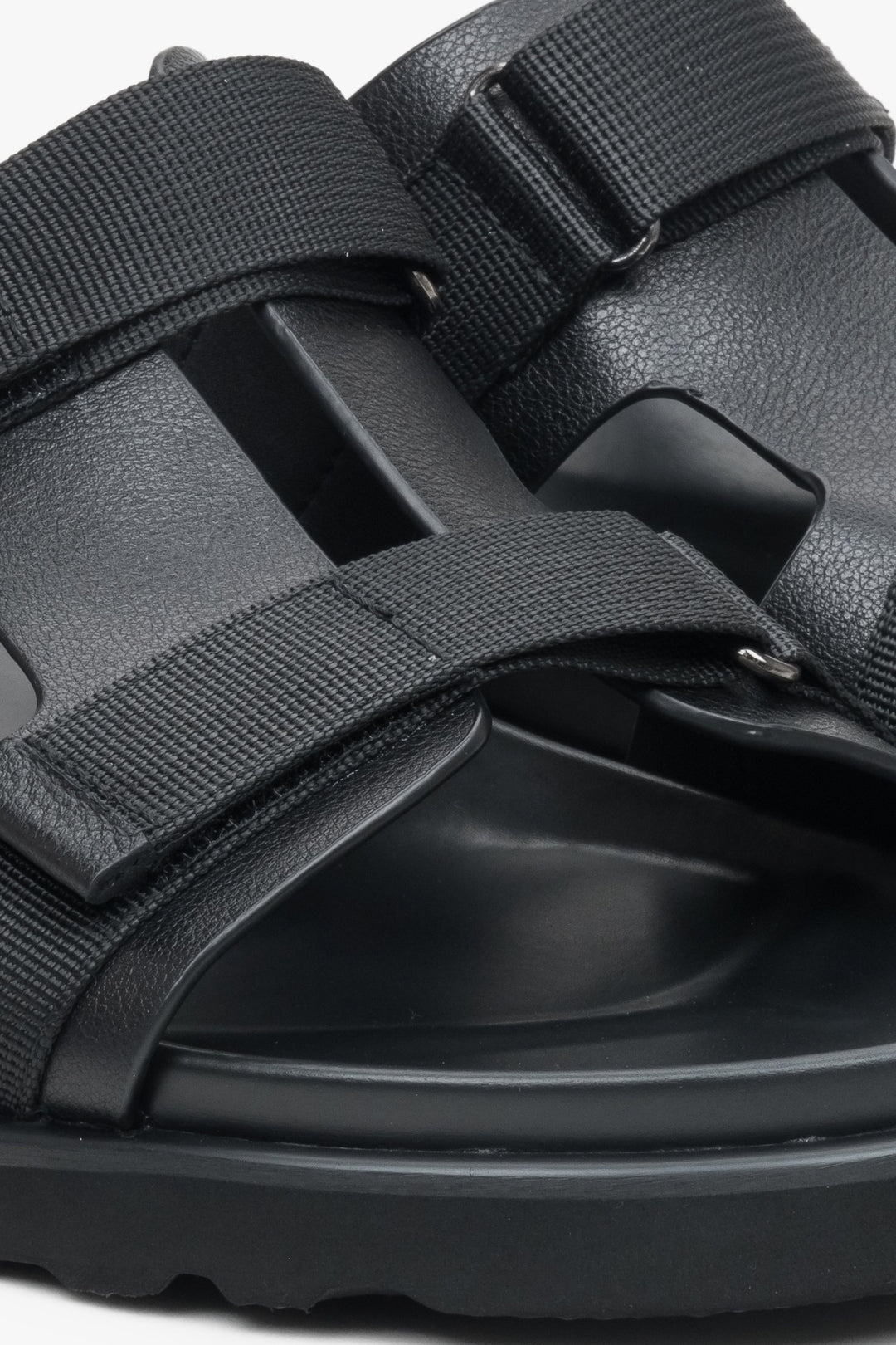 Estro men's black leather sandals - close-up on the fastening system and details.