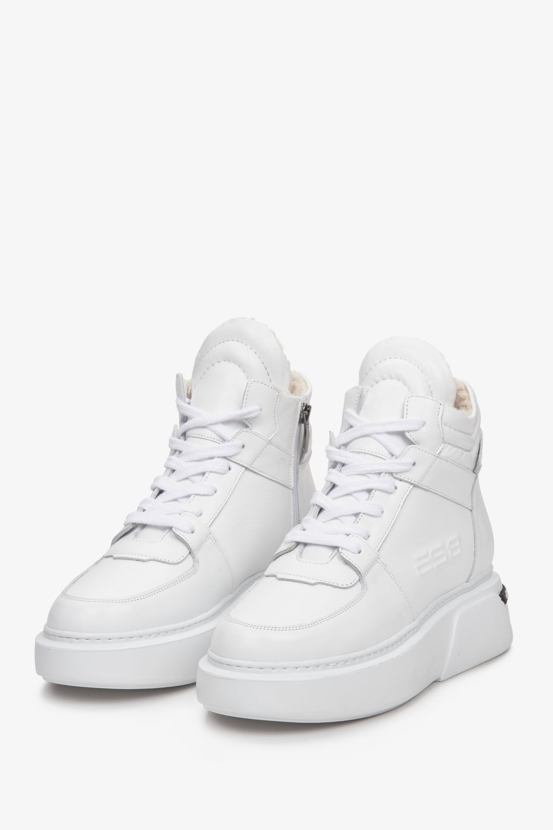White, high-top women's winter sneakers made of suede and genuine leather by Estro.