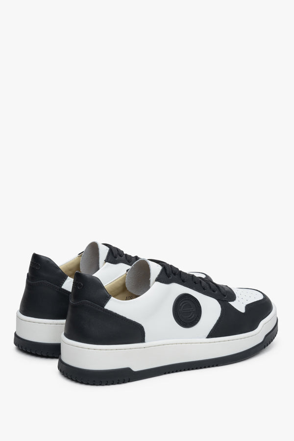 Black-and-white leather women's sneakers with laces by Estro - close-up on the heel and side seam.