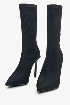High-heeled women's boots in black by Estro - close-up on the toe of the shoe.