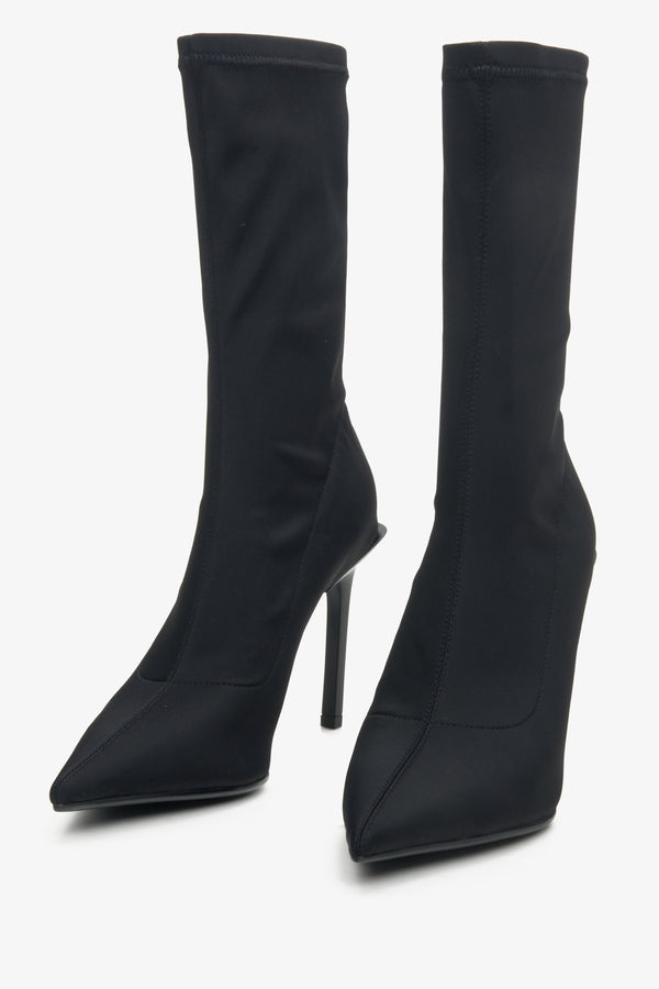 High-heeled women's boots in black by Estro - close-up on the toe of the shoe.