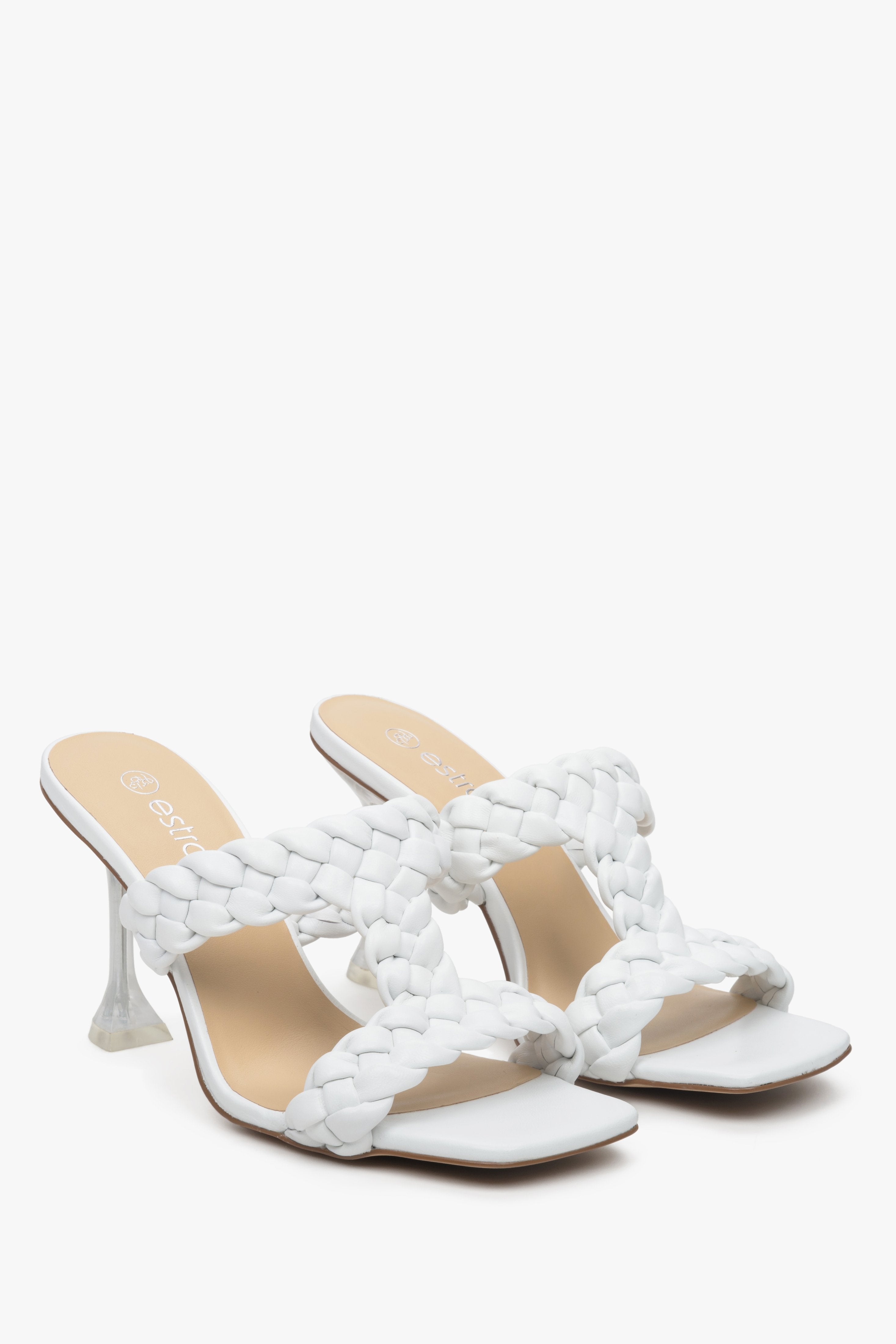 White leather women's mules on a funnel heel, Estro brand.