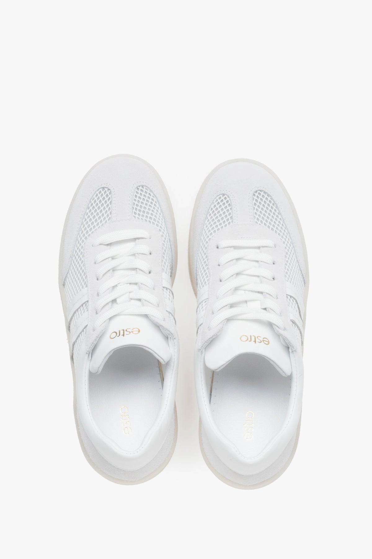 White and beige sneakers for women, featuring an upper of Italian leather and breathable mesh panels.
