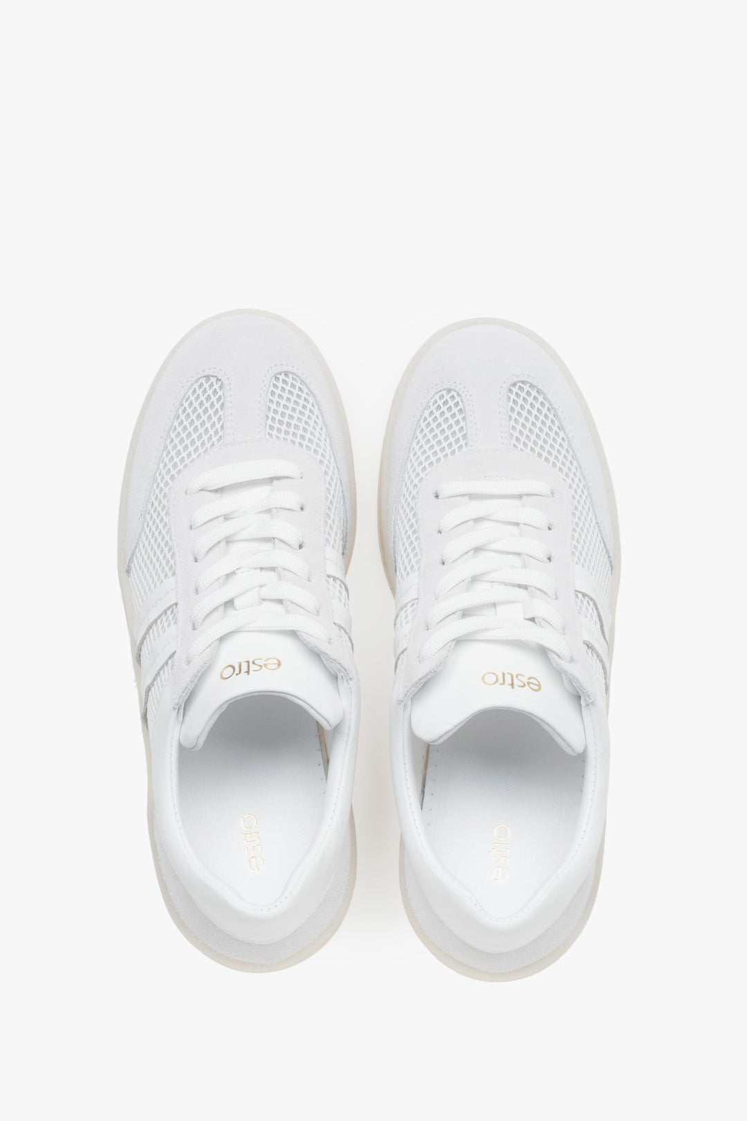White and beige sneakers for women, featuring an upper of Italian leather and breathable mesh panels.