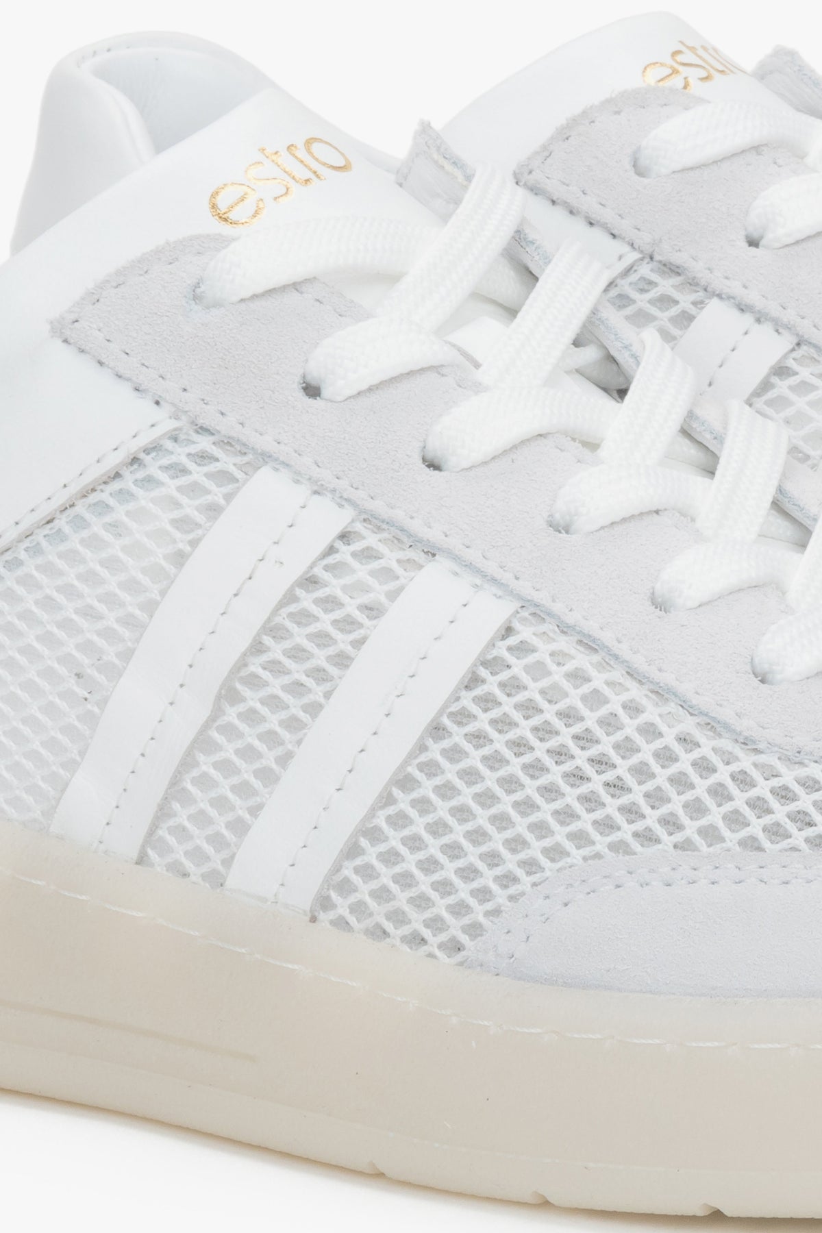 A pair of women's sneakers combining breathable mesh with Italian genuine leather in a white and beige colorway.