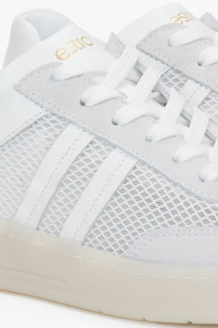 A pair of women's sneakers combining breathable mesh with Italian genuine leather in a white and beige colorway.