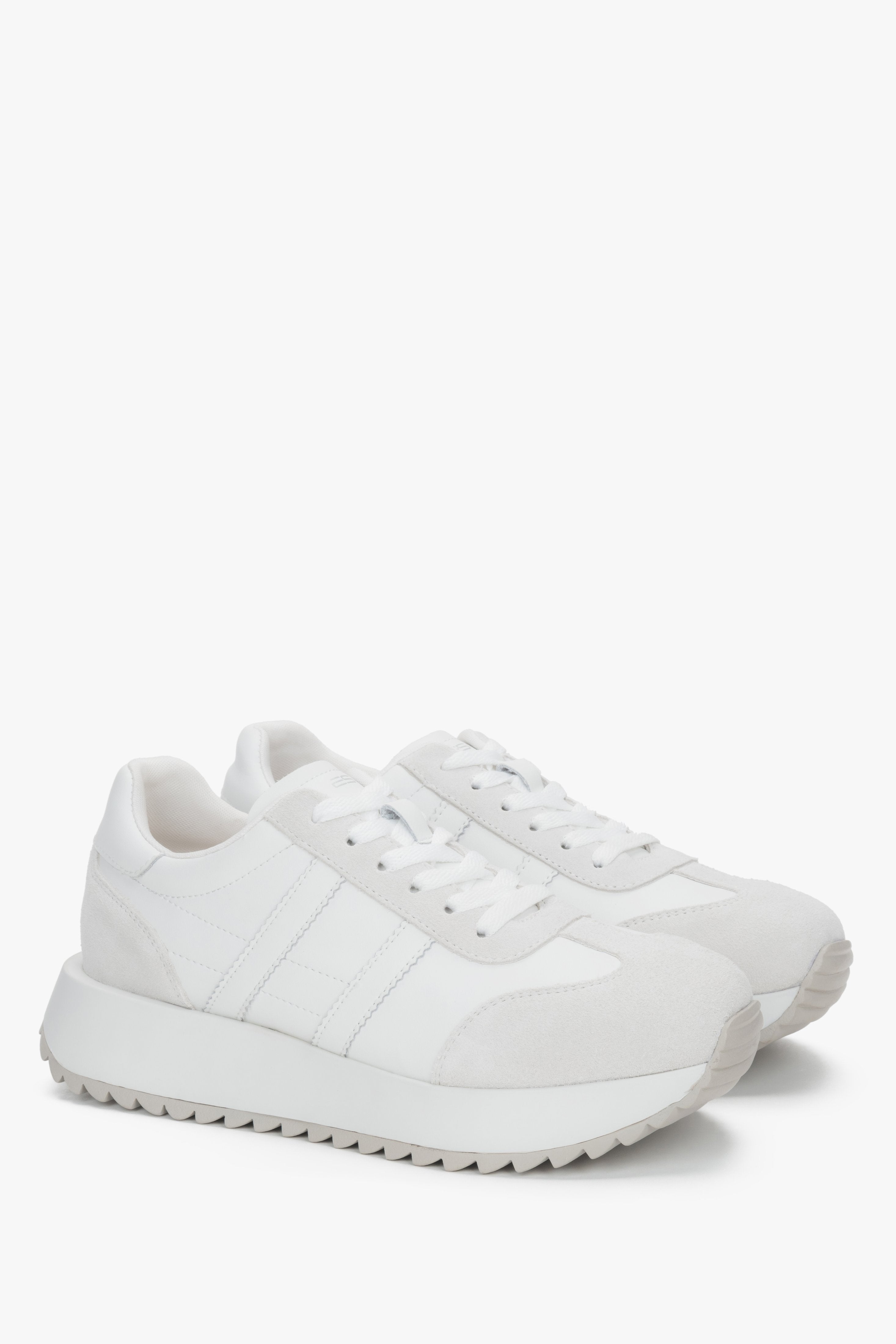 Women's white sneakers made of a combination of genuine leather and velour.