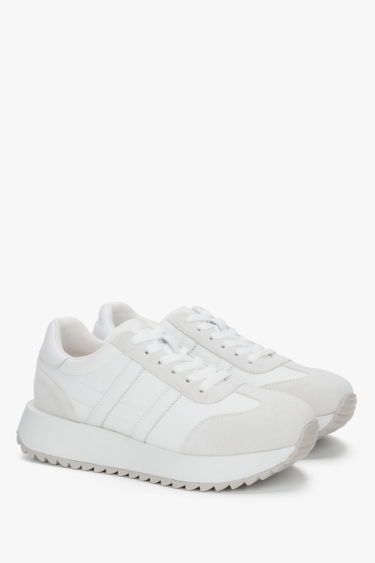 Women's white sneakers made of a combination of genuine leather and velour.