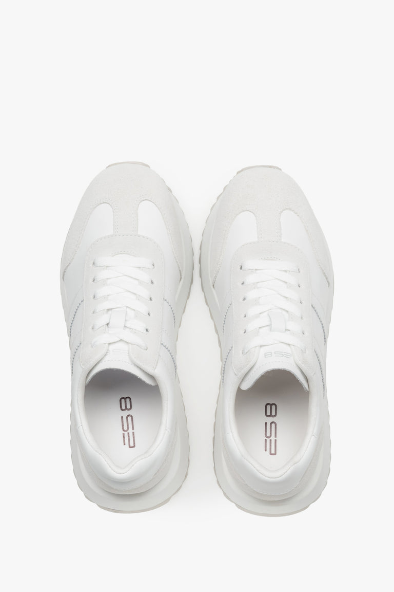 Women's white sneakers combining a smooth leather base with suede panels.