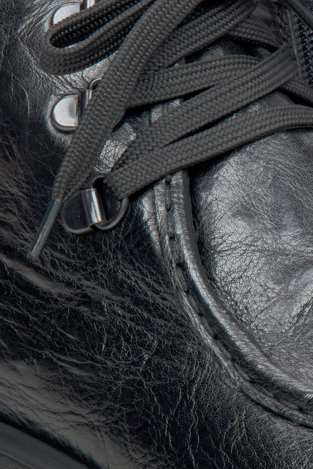 Men's black boots - close-up on the details.
