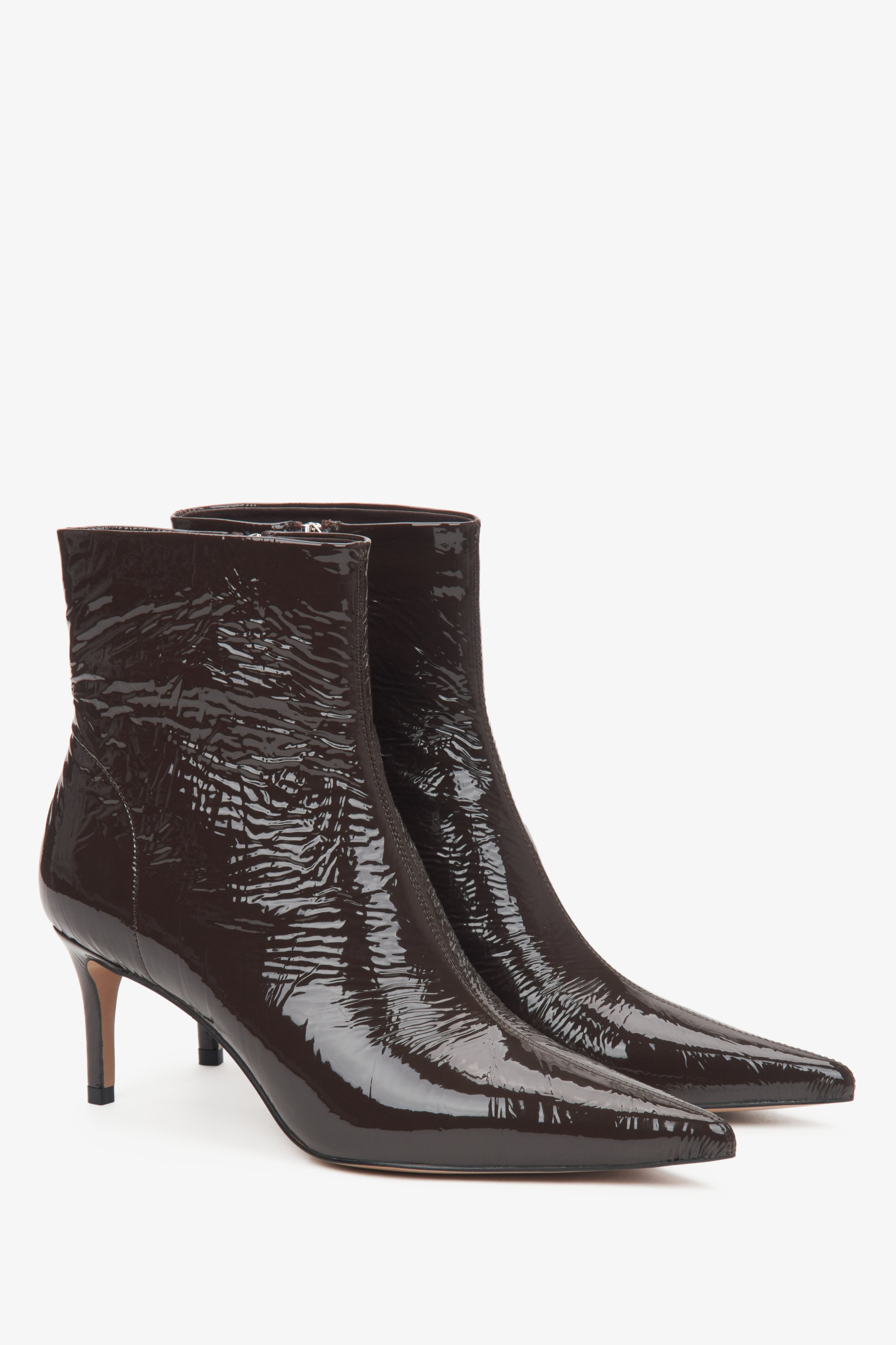 Dark brown patent ankle boots for women by Estro with a stiletto heel.