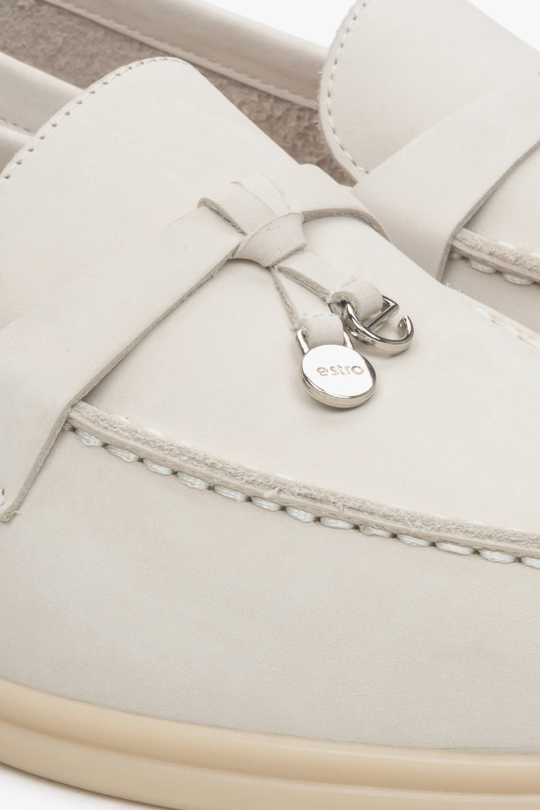 Women's light beige tassel loafers made with nubuck - details.