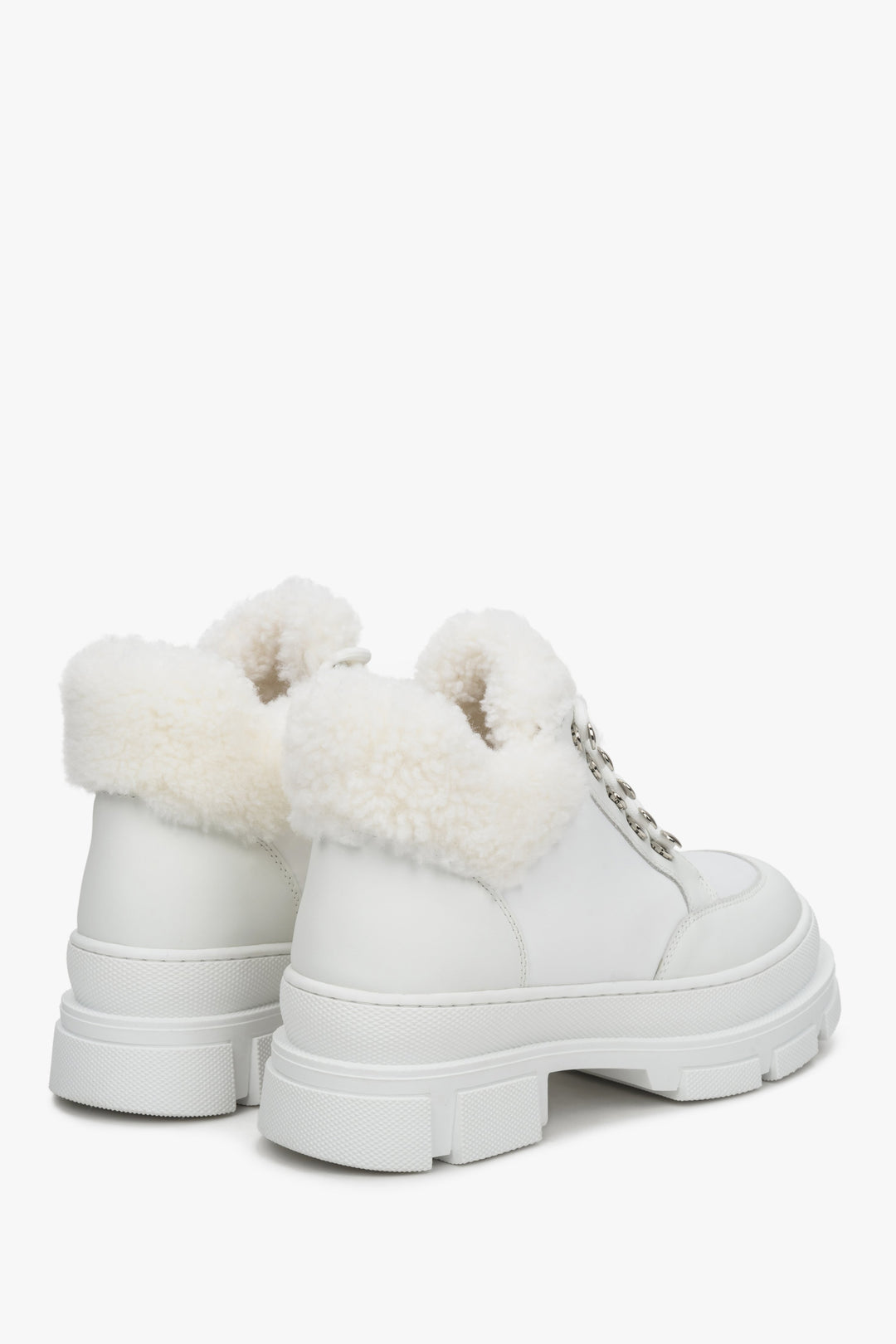 Women's white winter boots made of genuine leather with natural fur - side and back of the shoes.